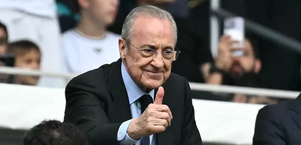 Club president giving a thumbs up in stadium