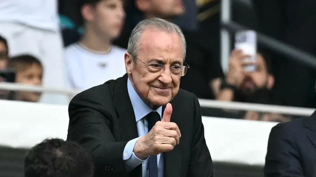 Club president giving a thumbs up in stadium