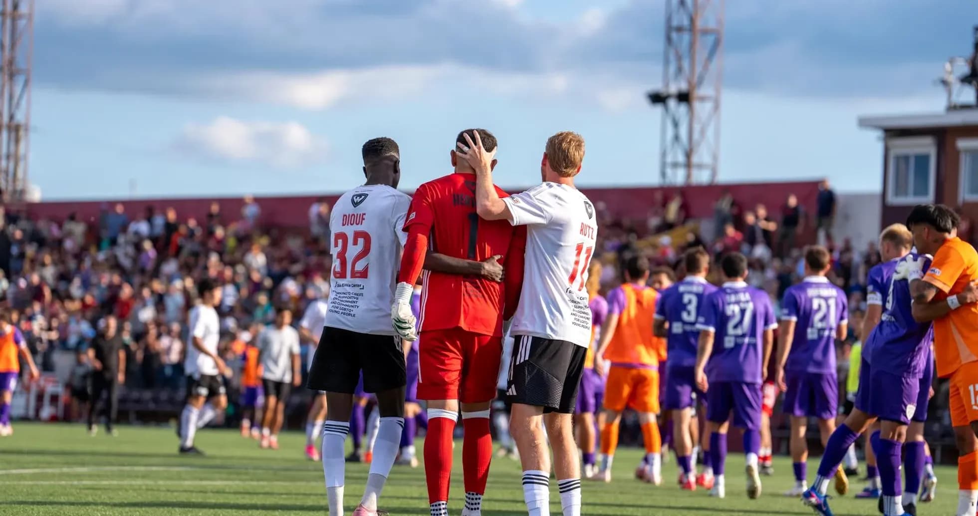 Players from both teams after the match