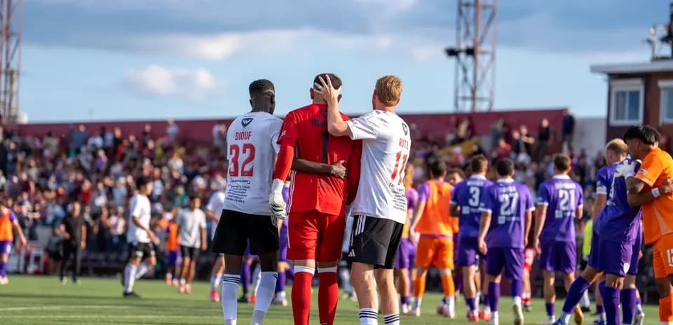 Players from both teams after the match