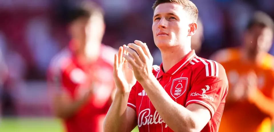 Player applauding in Nottingham Forest home kit