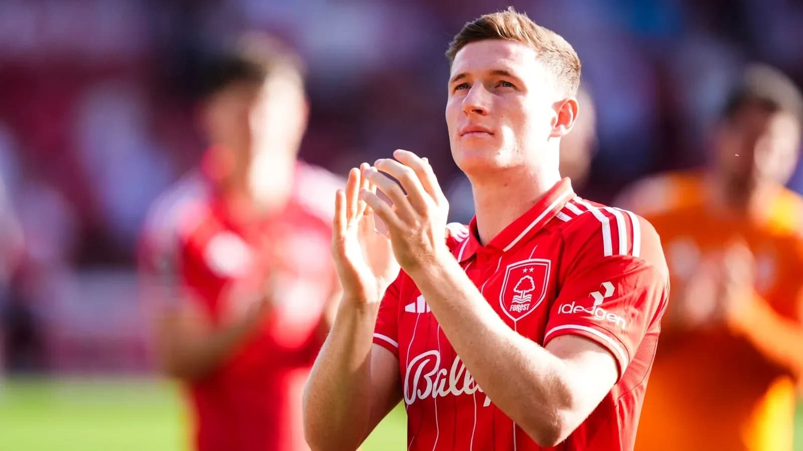 Player applauding in Nottingham Forest home kit