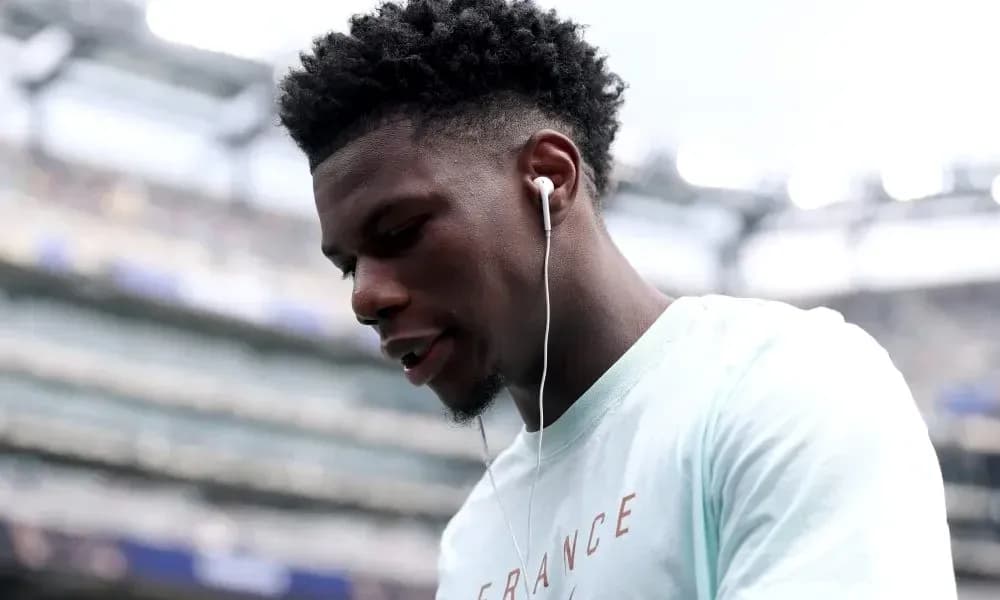 Player wearing earbuds before the match