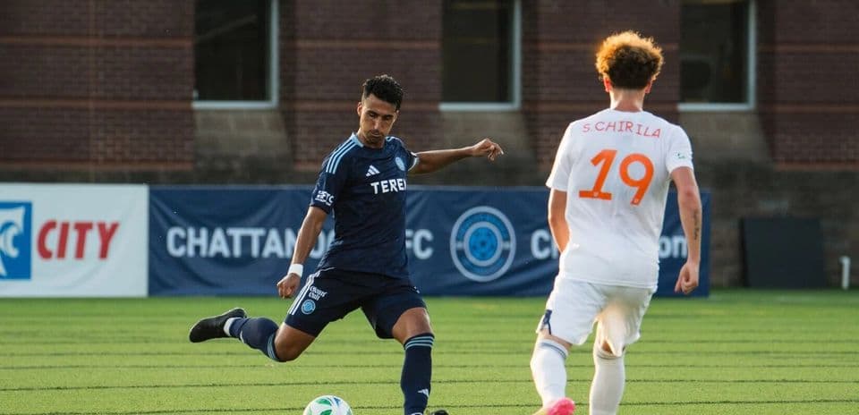 FC Cincinnati II player kicking the ball