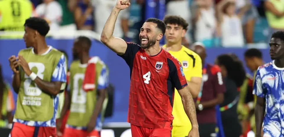 Player celebrating after match with teammates in background