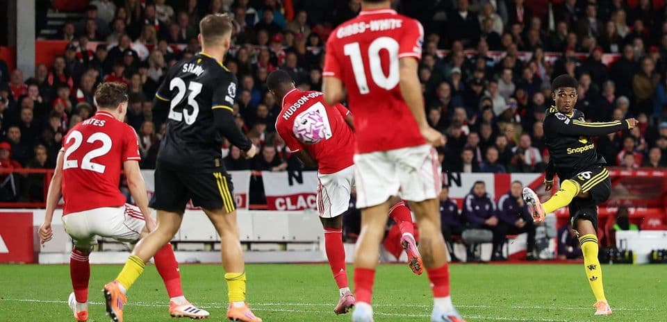 Player shooting during Manchester United match