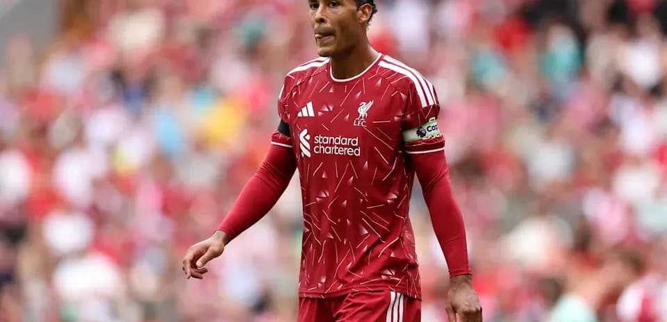 Virgil van Dijk in Liverpool kit on pitch