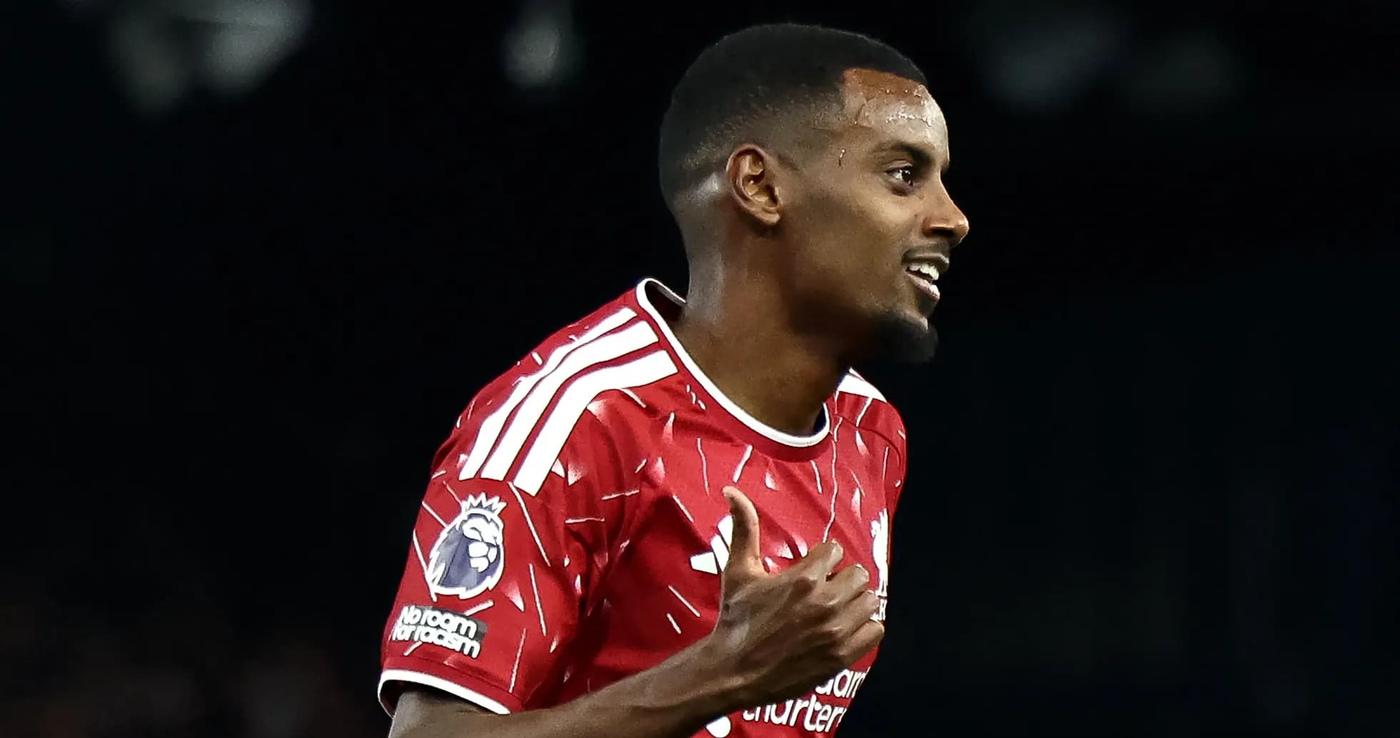 Player celebrating goal in Liverpool red jersey