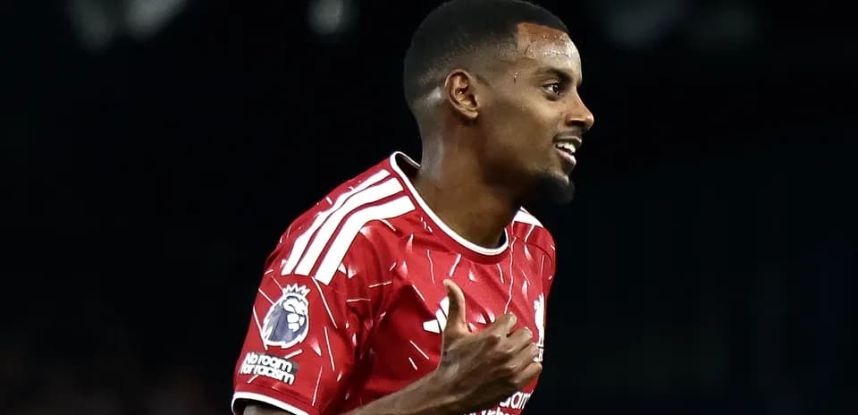 Player celebrating goal in Liverpool red jersey
