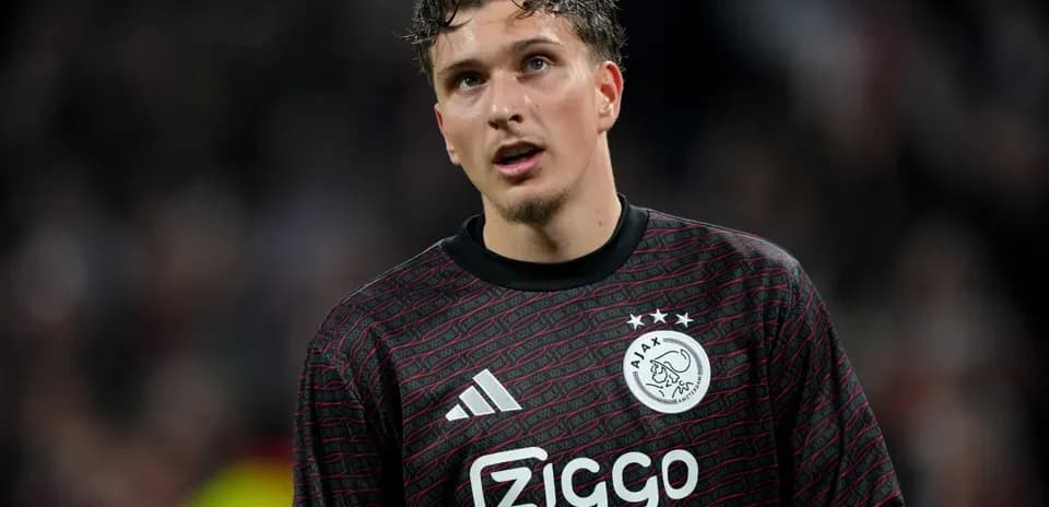 Goalkeeper in Ajax uniform during a match