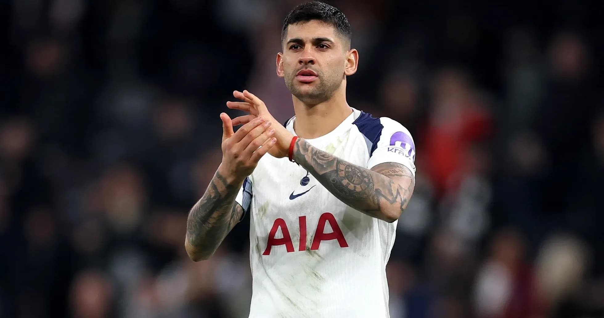 Player applauding fans after the match