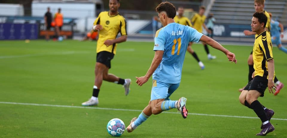 Player from Sporting JAX kicking the ball