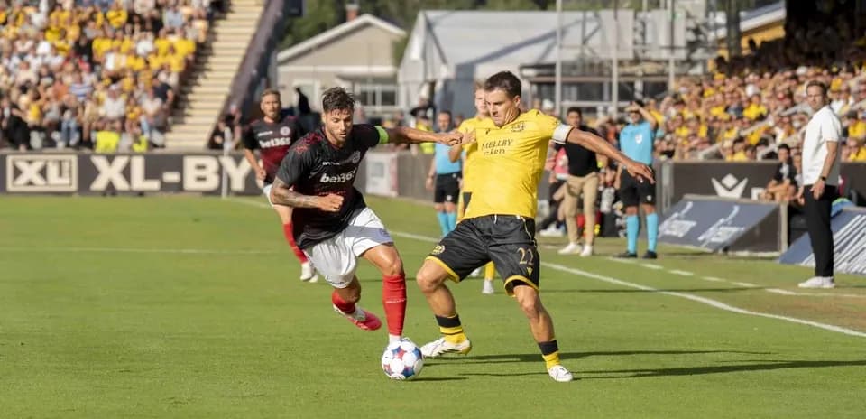 Players contesting for the ball during match