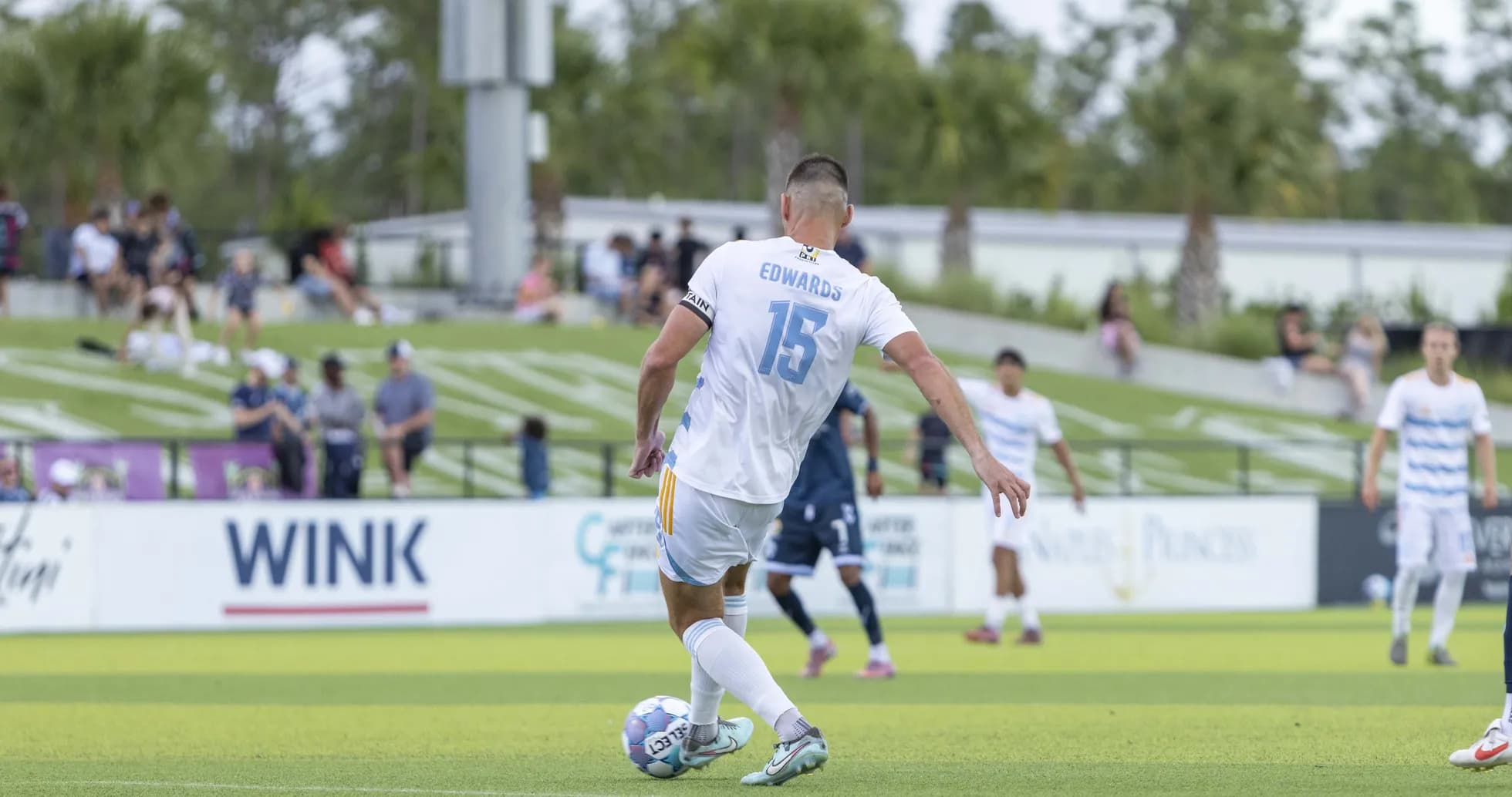 Player Edwards preparing to take a free kick