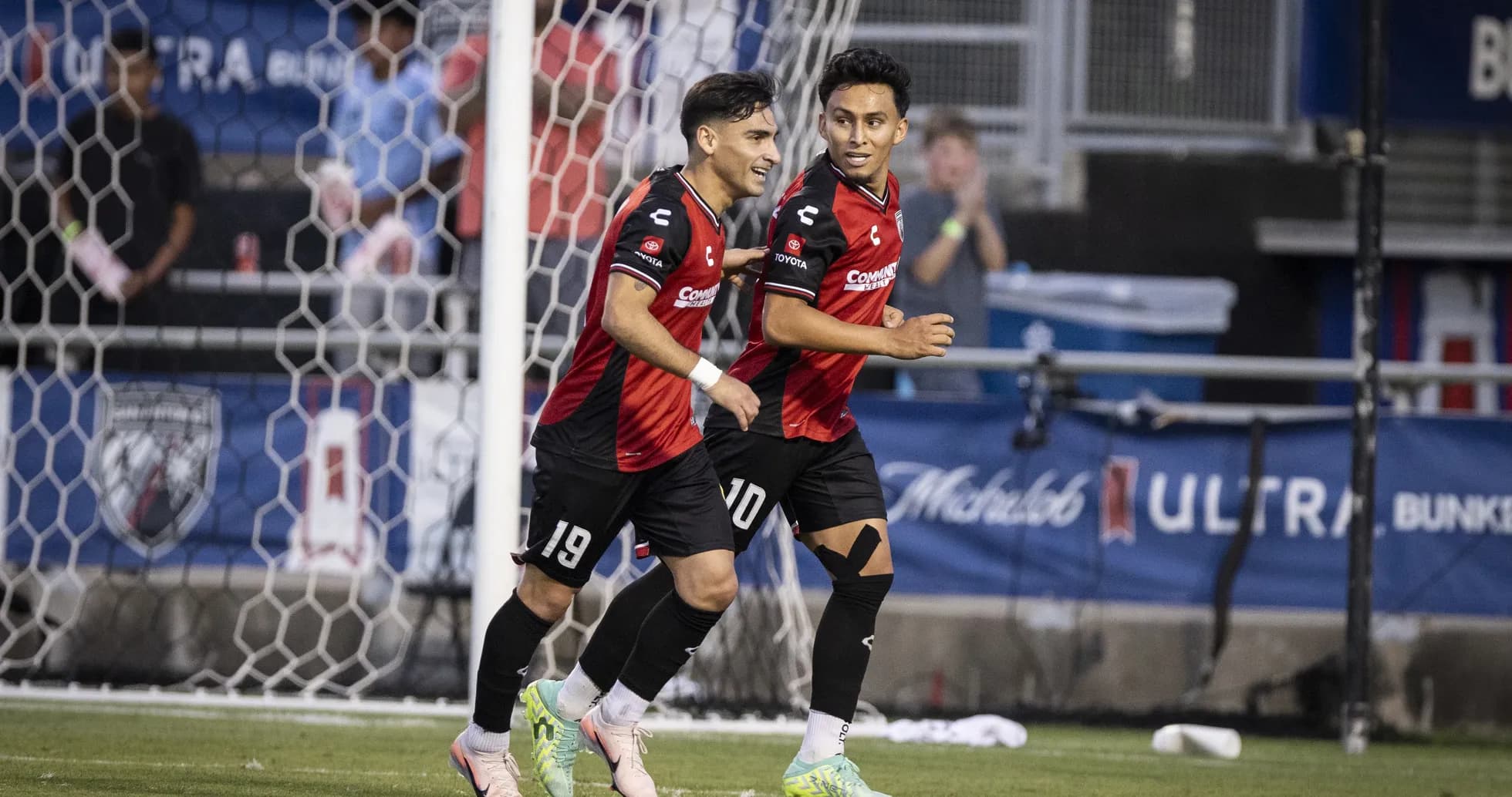 Players celebrating a goal in USL Championship