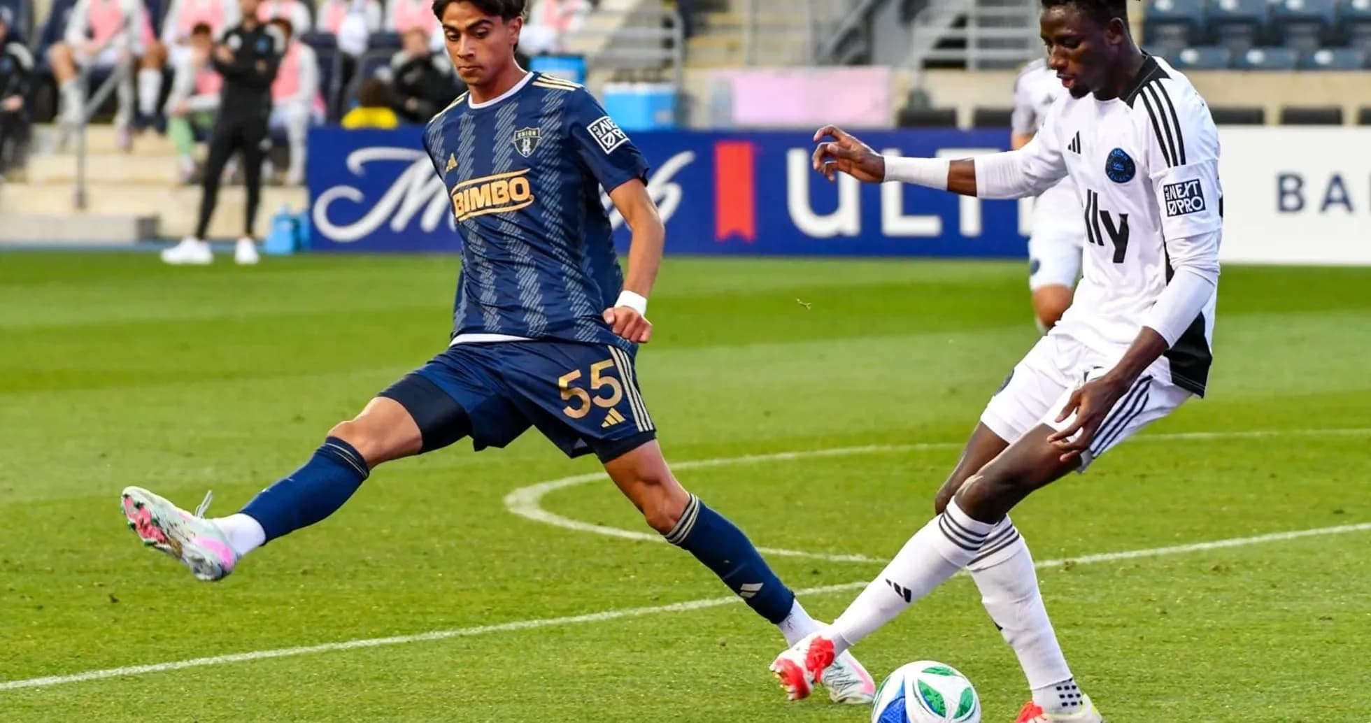 Players competing for the ball during match