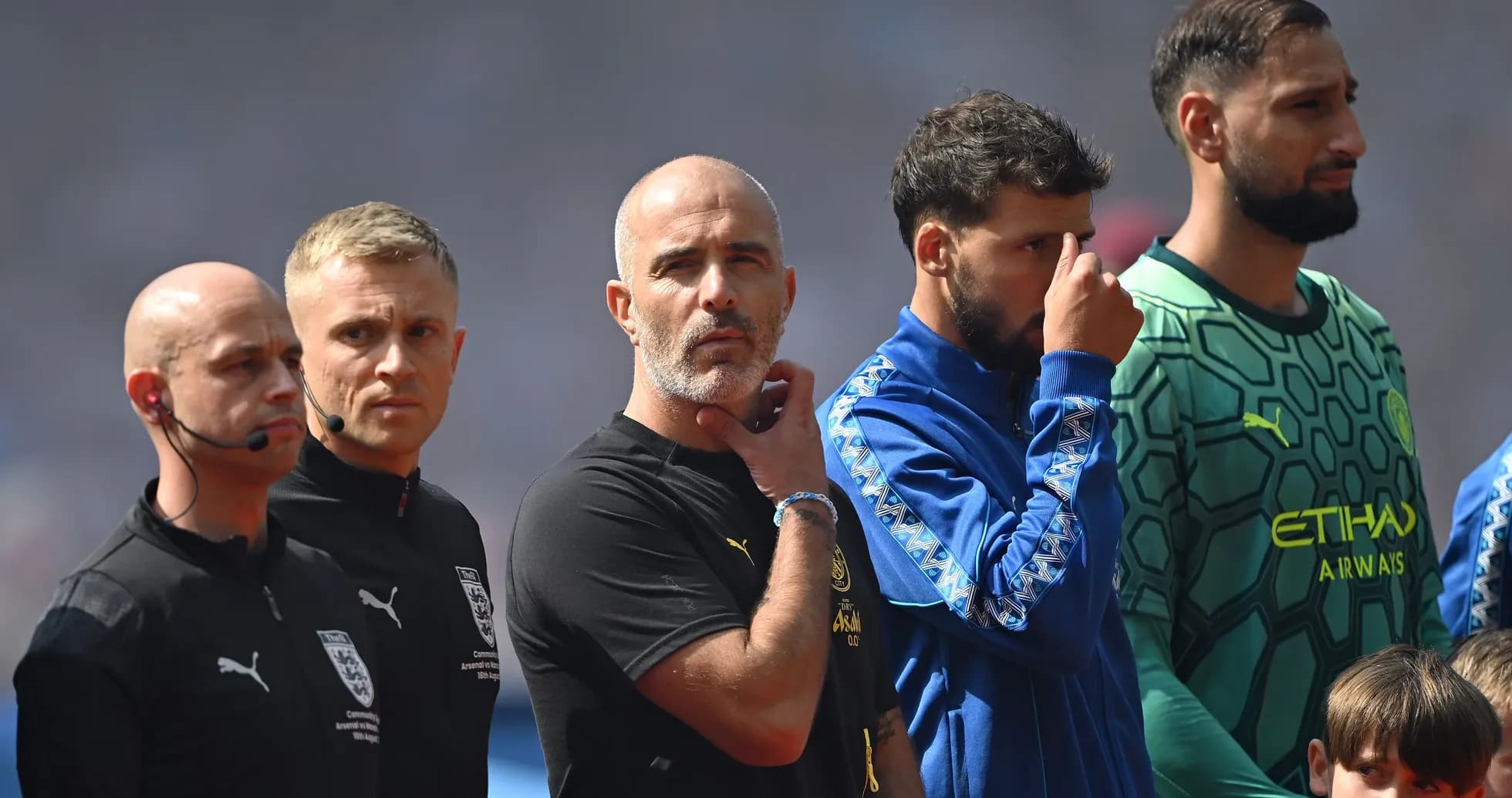 Coaches and players lined up before the match