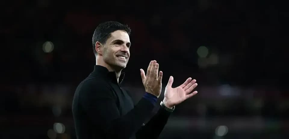 Manager clapping and smiling on the sidelines