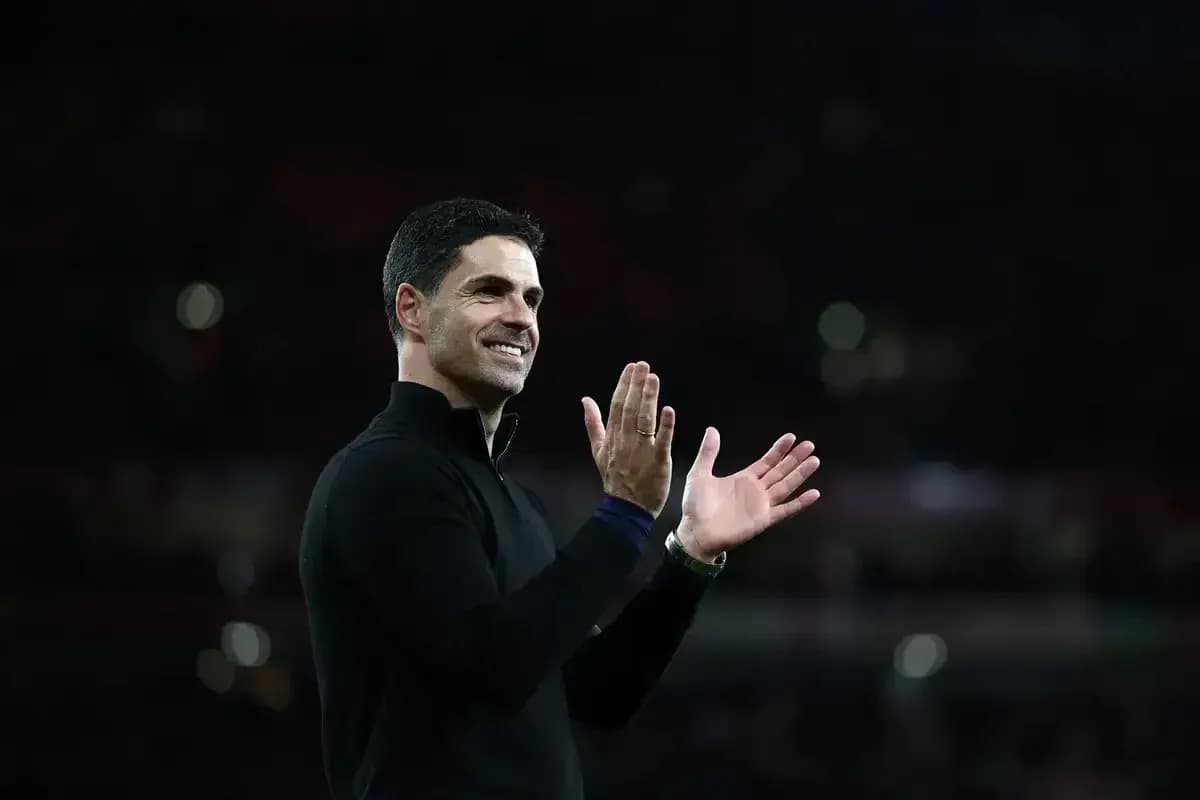Manager clapping and smiling on the sidelines