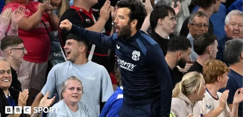 Player celebrating with fans in the stadium