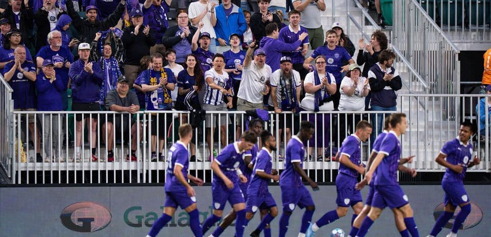 Louisville City fans celebrating during a match