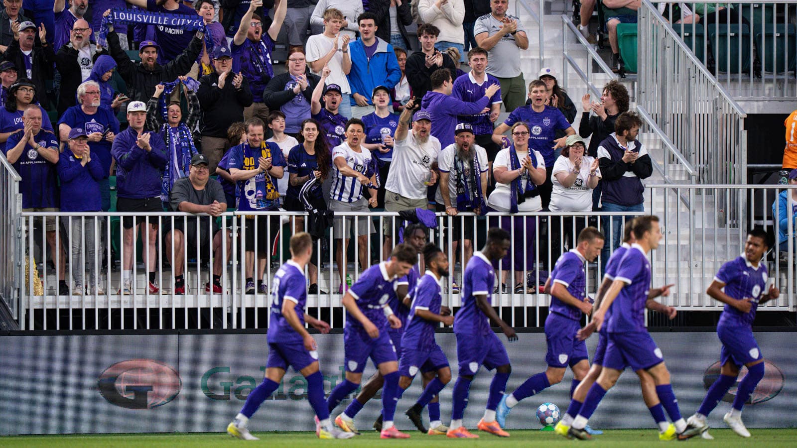 Louisville City fans celebrating during a match