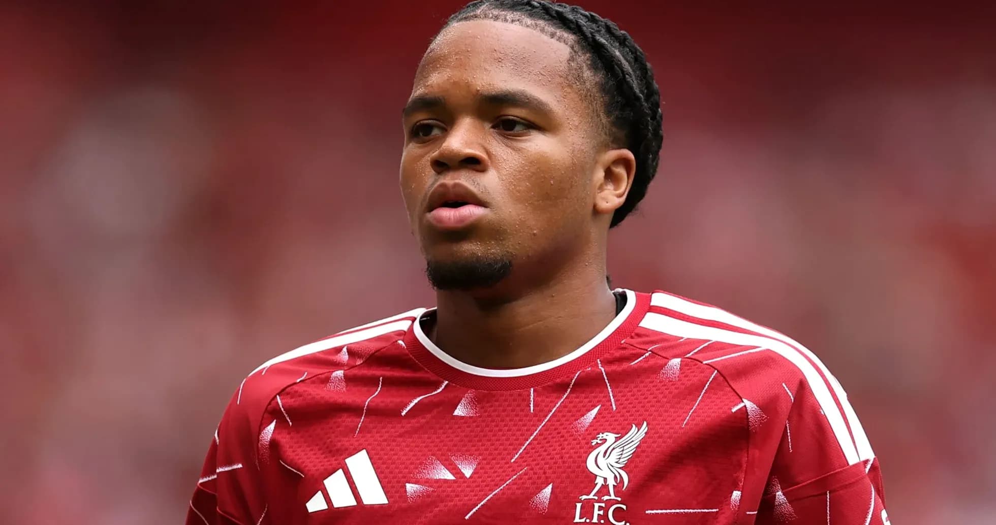 Player in red Liverpool jersey during match warm-up