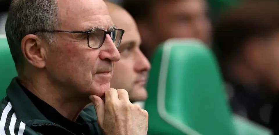 Coach observing from the bench during a match