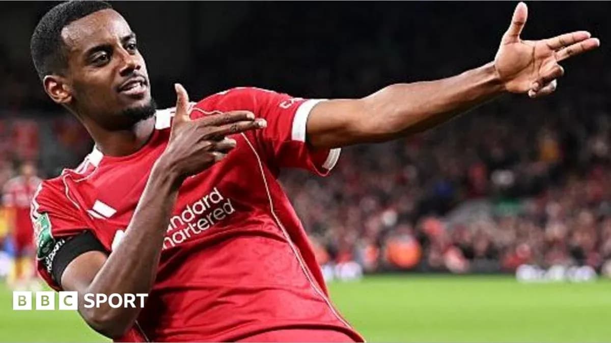 Player celebrating goal in Liverpool jersey Player celebrating goal in Liverpool jersey