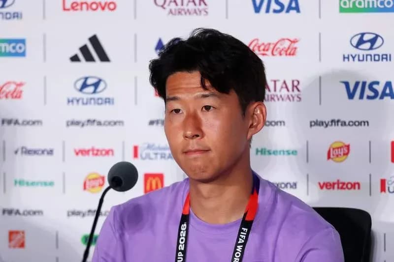Player at press conference with sponsor logos in background Player at press conference with sponsor logos in background