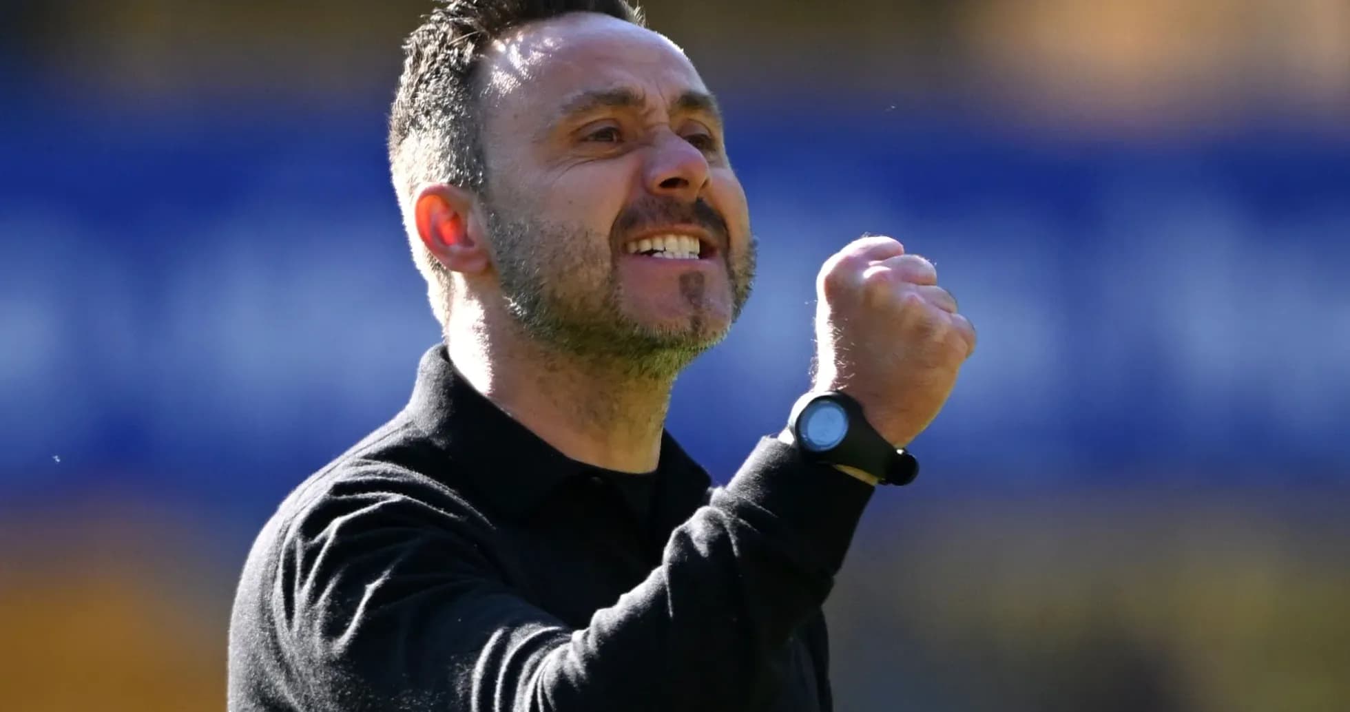 Coach celebrating a goal with clenched fist Coach celebrating a goal with clenched fist