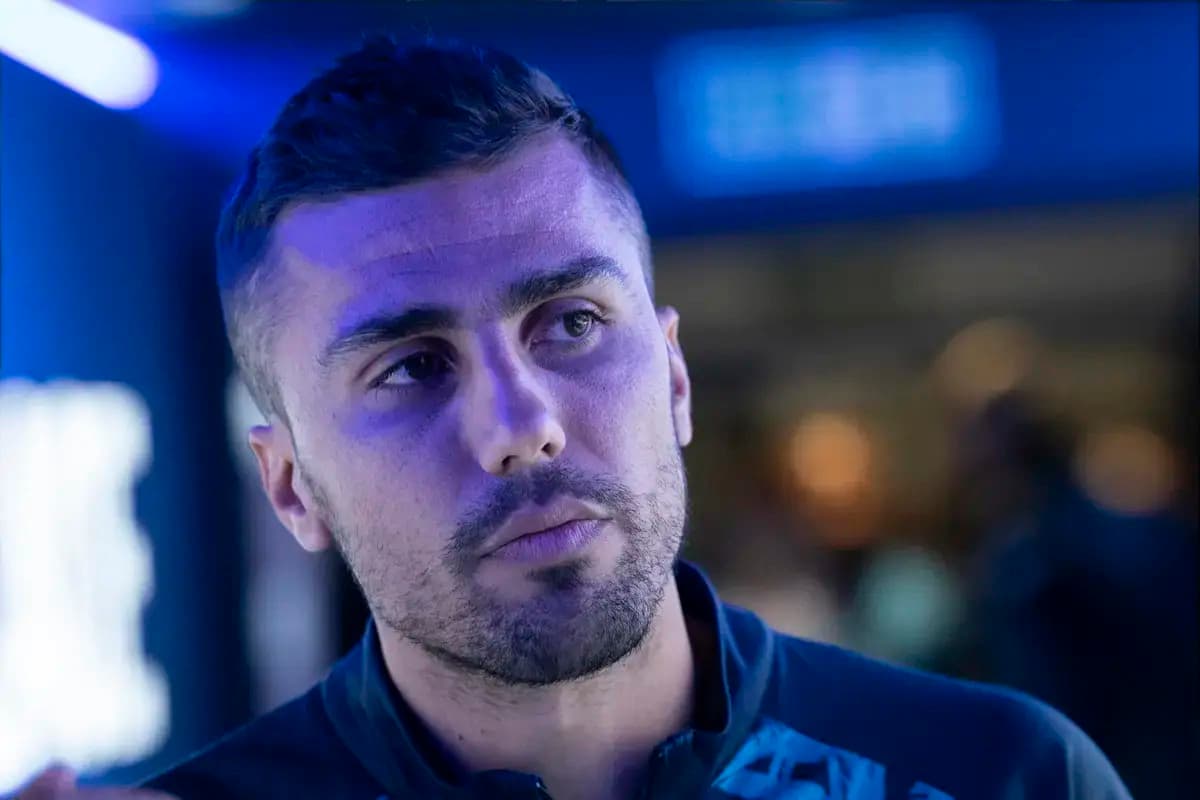 Athlete in blue lighting during an event Athlete in blue lighting during an event