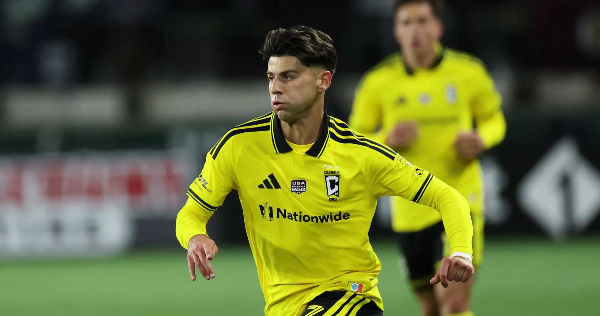 Columbus Crew player running during match Columbus Crew player running during match