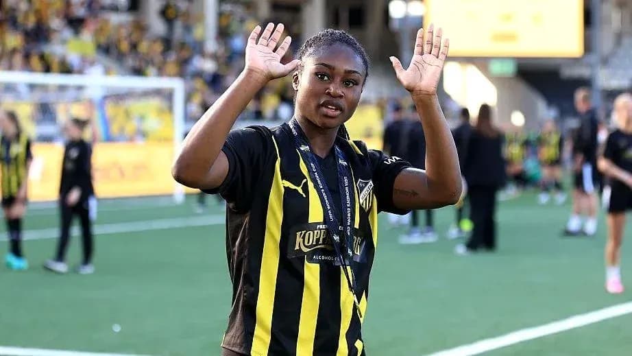 Player celebrating with raised hands on field Player celebrating with raised hands on field