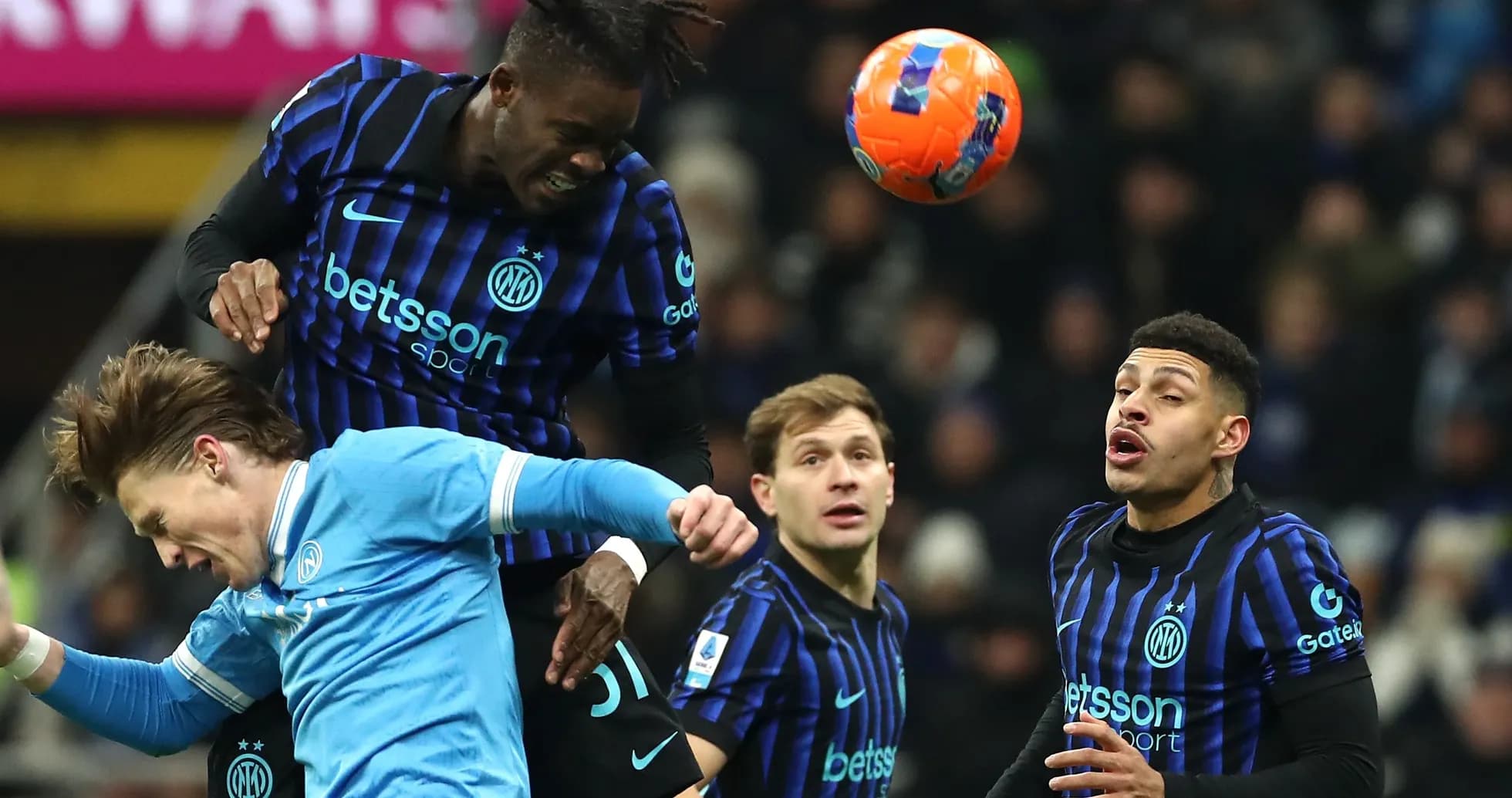 Player heading the ball during a football match Player heading the ball during a football match