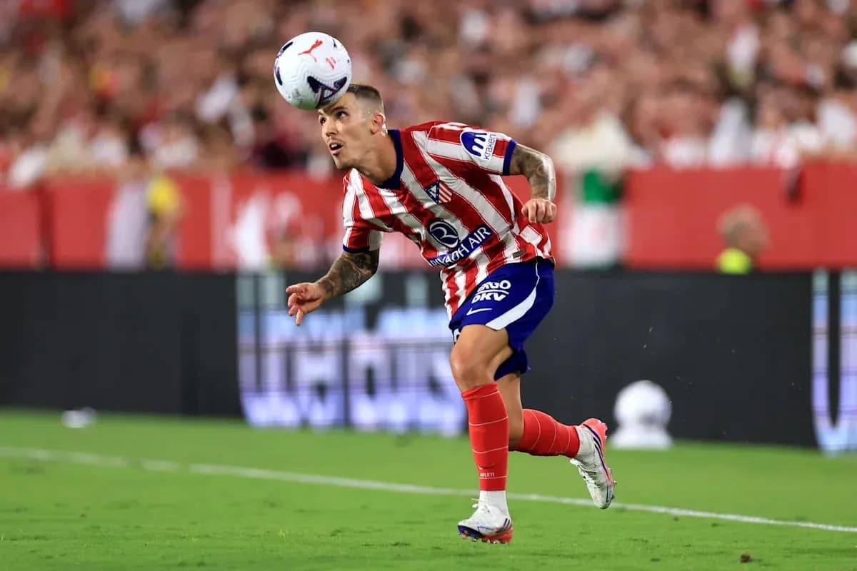 Player heading the ball during a football match Player heading the ball during a football match