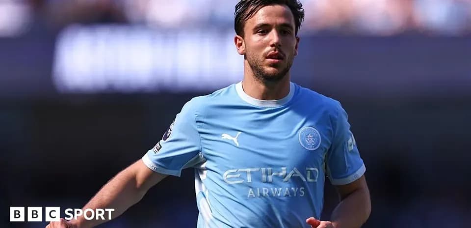 Player in light blue jersey running on the field Player in light blue jersey running on the field