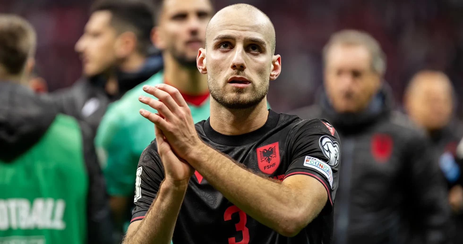 Albanian player applauding fans after the match Albanian player applauding fans after the match