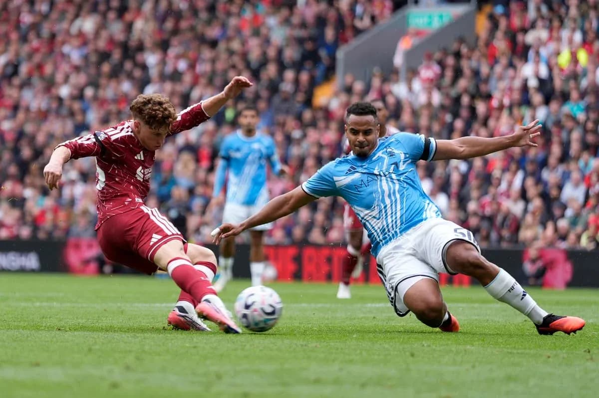 Player tackling opponent during a football match Player tackling opponent during a football match