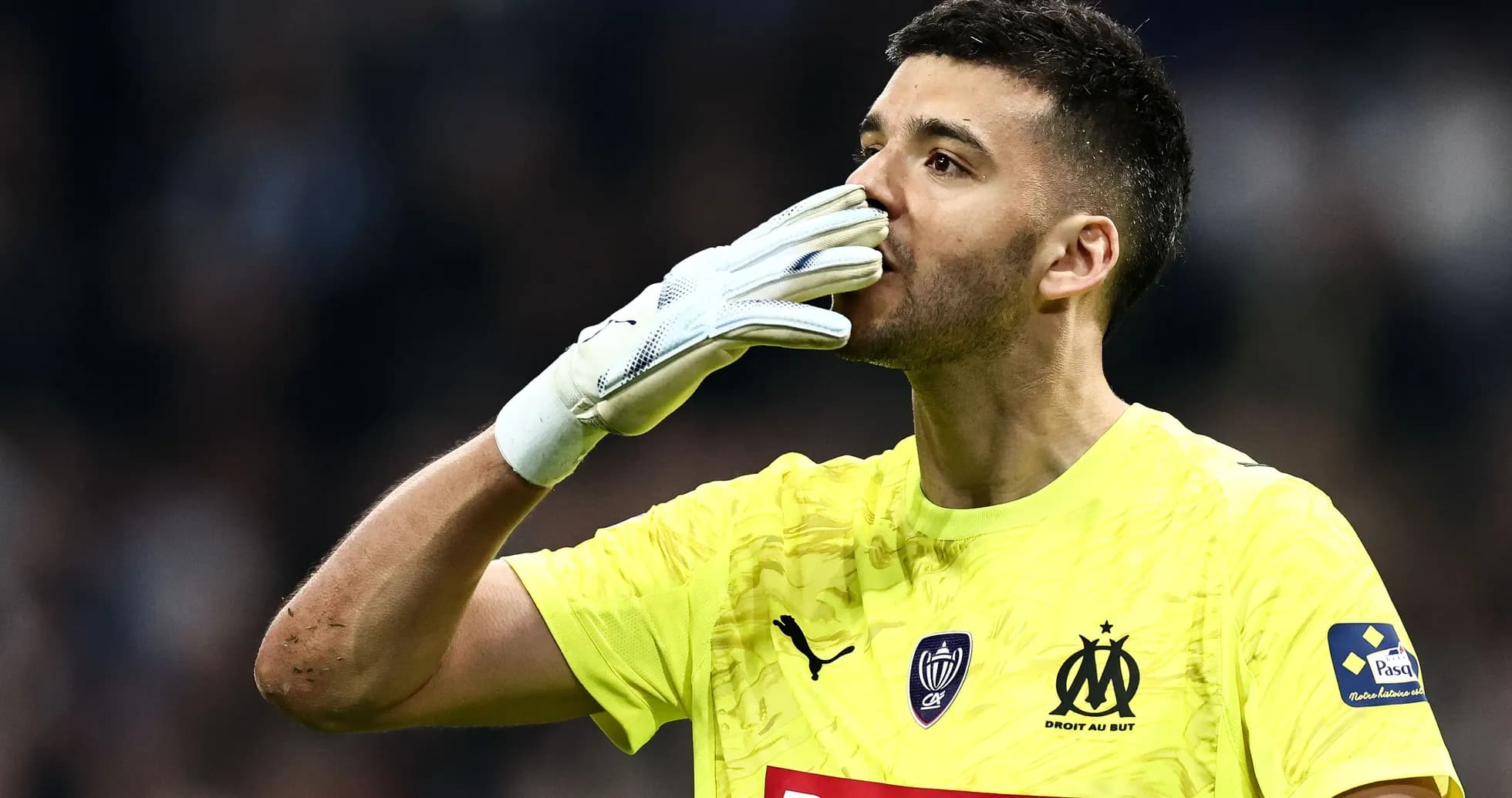 Goalkeeper celebrating with gloves raised during match Goalkeeper celebrating with gloves raised during match