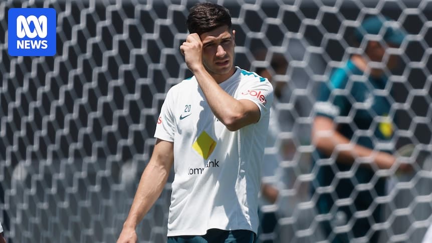 Player adjusting his hair during training session Player adjusting his hair during training session