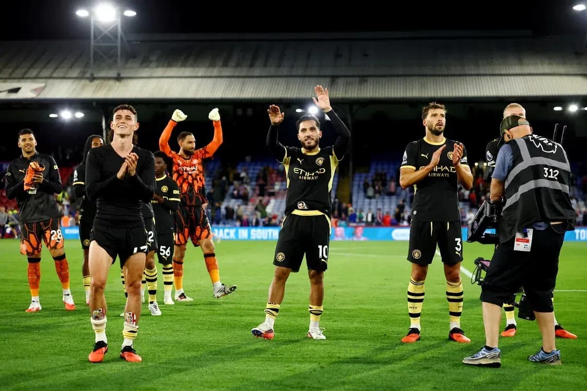 Players celebrating and applauding fans after match Players celebrating and applauding fans after match