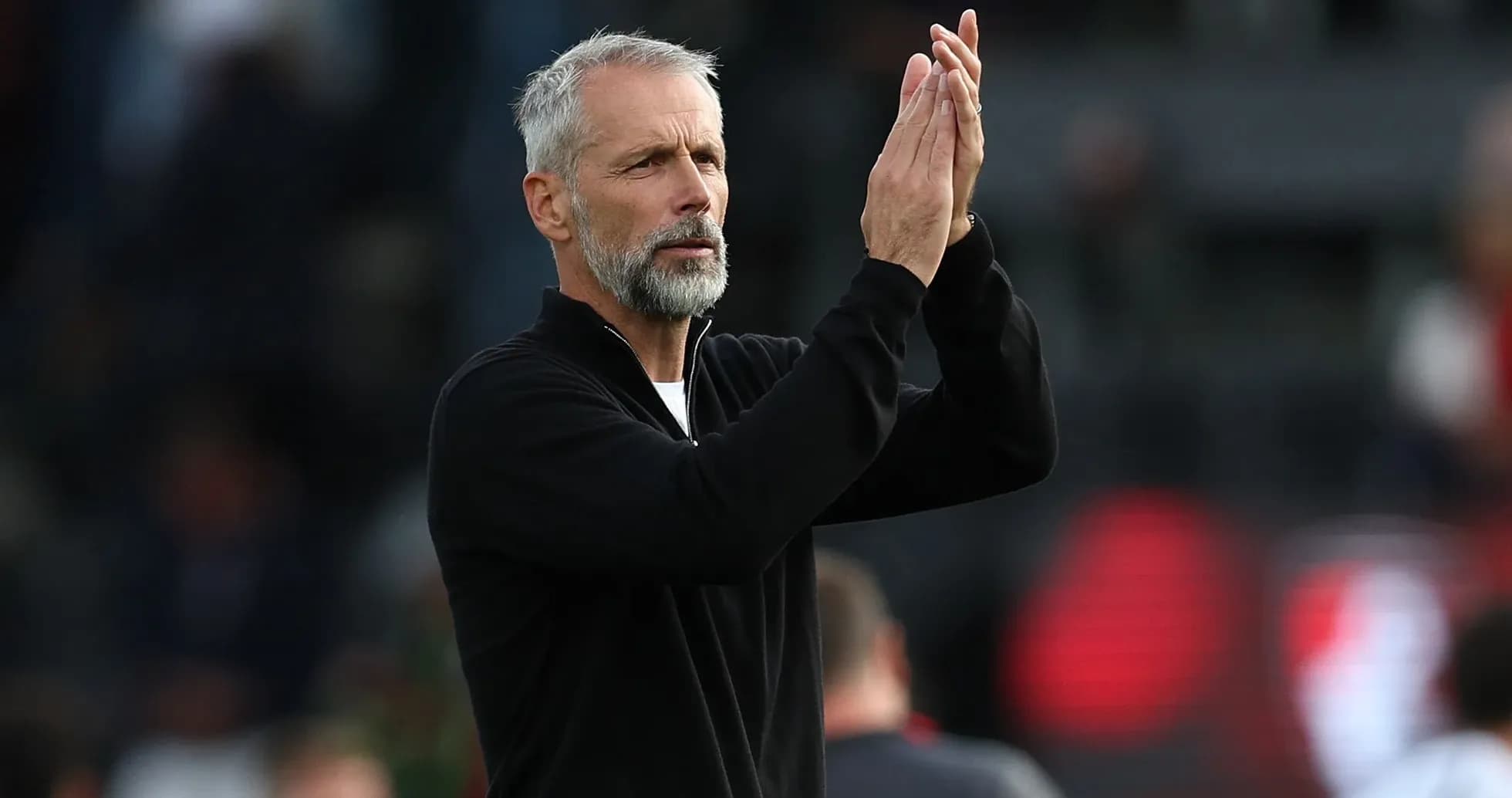 Coach applauding during a match Coach applauding during a match