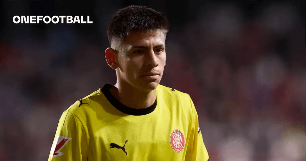 Goalkeeper in yellow jersey walking on the field Goalkeeper in yellow jersey walking on the field