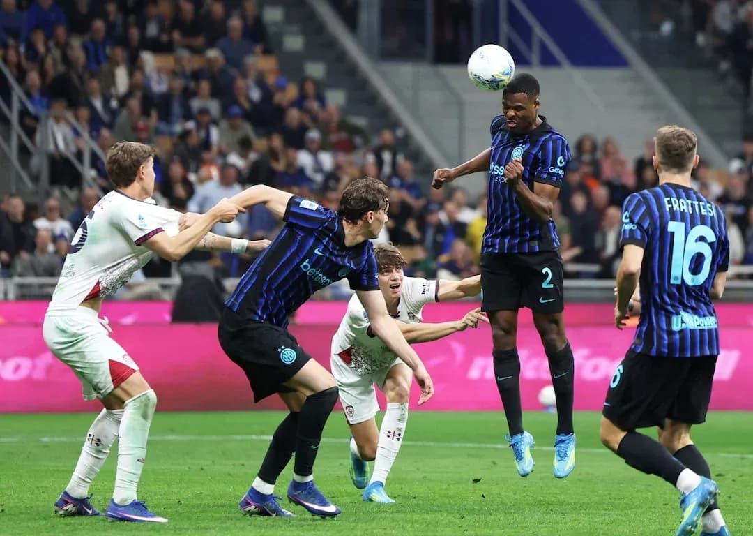 Inter player heads the ball during match Inter player heads the ball during match