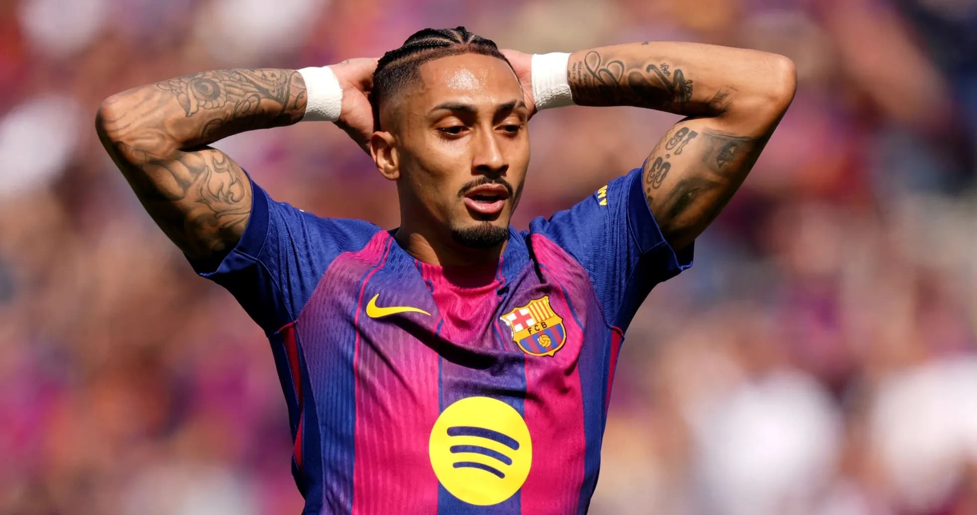 Player with tattoos celebrating during match Player with tattoos celebrating during match