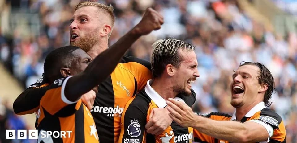Players celebrating a goal during a match Players celebrating a goal during a match