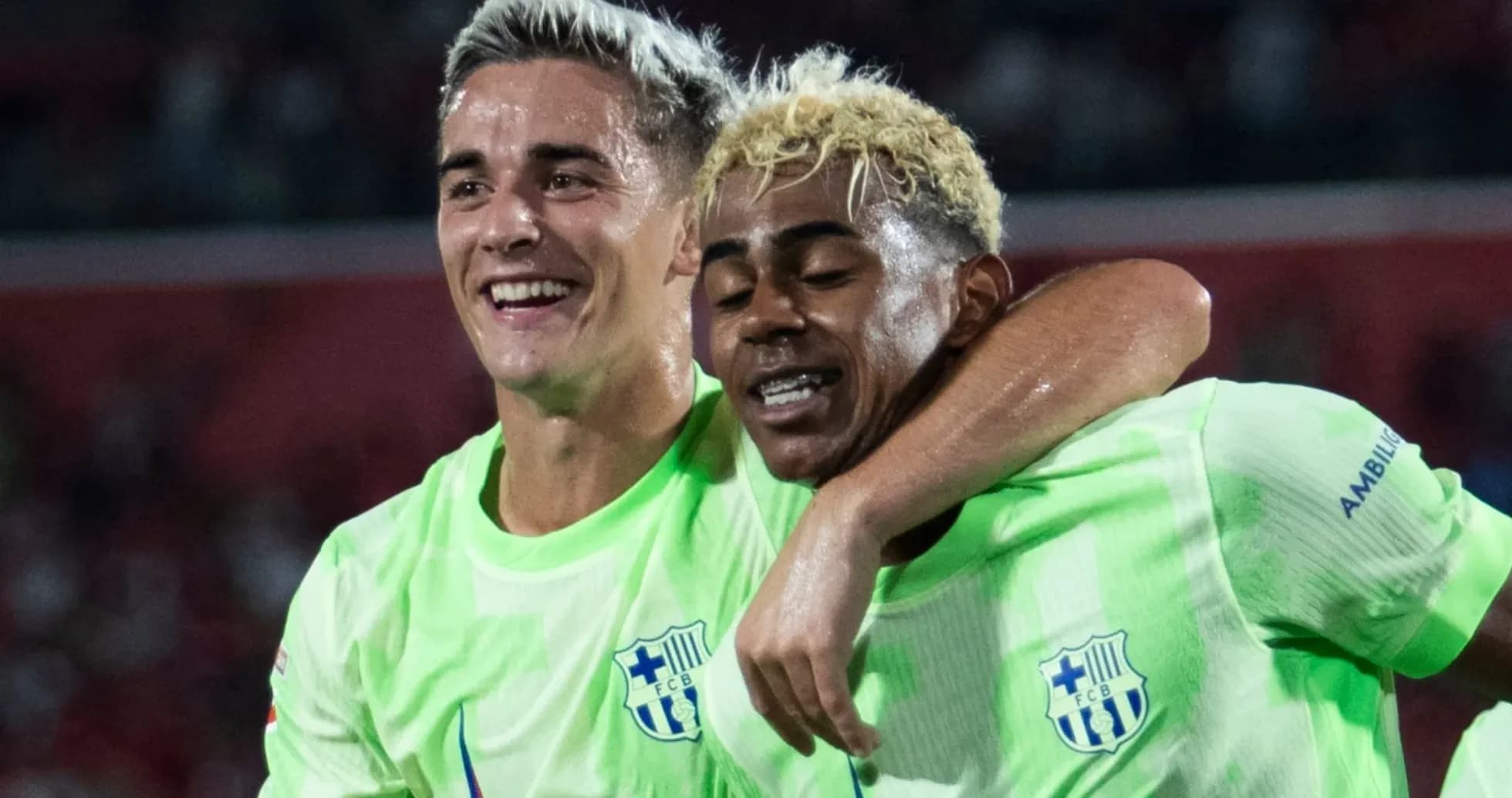 Two players celebrating together on the field Two players celebrating together on the field