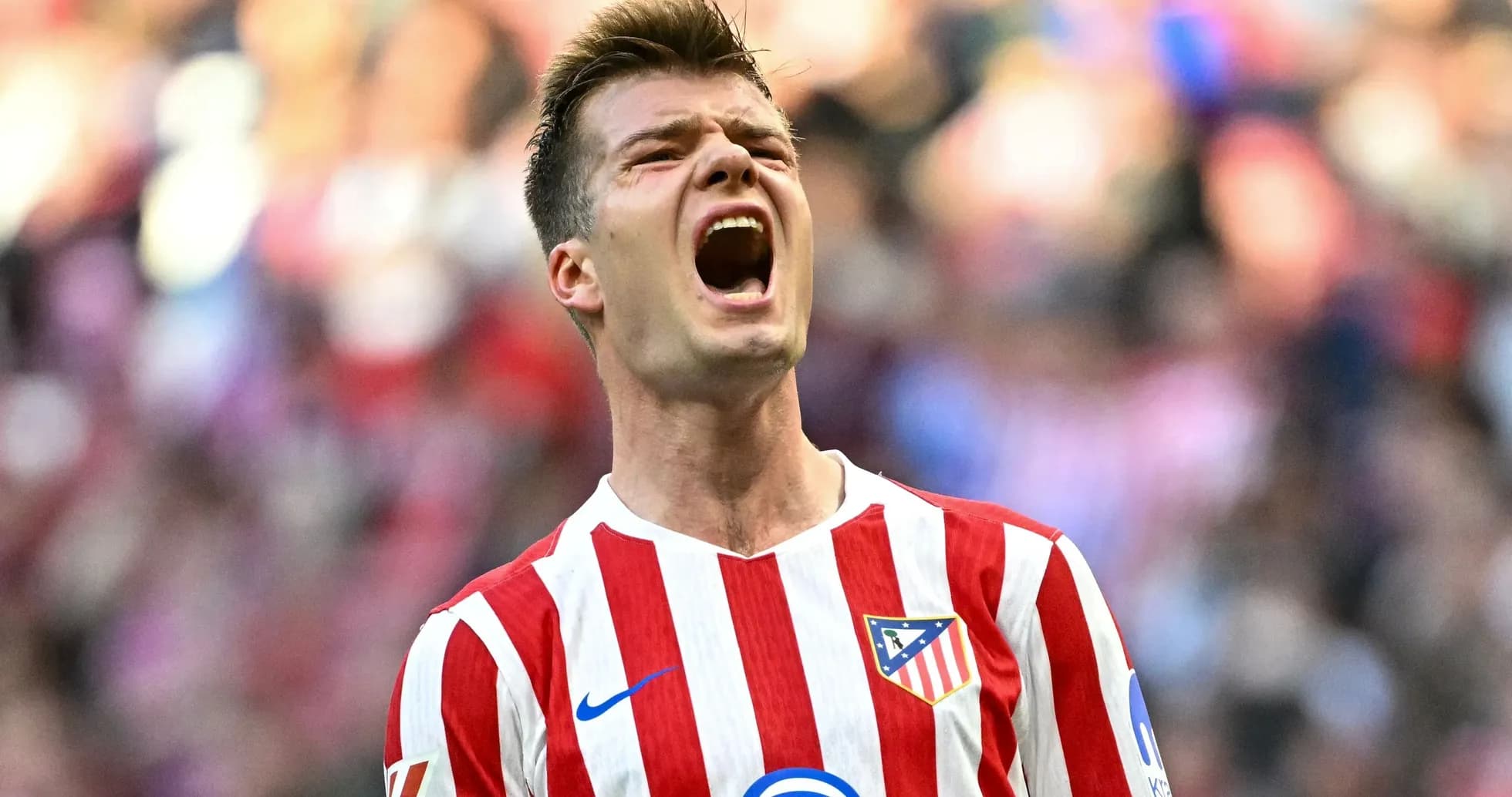 Player celebrating in Atlético Madrid jersey Player celebrating in Atlético Madrid jersey