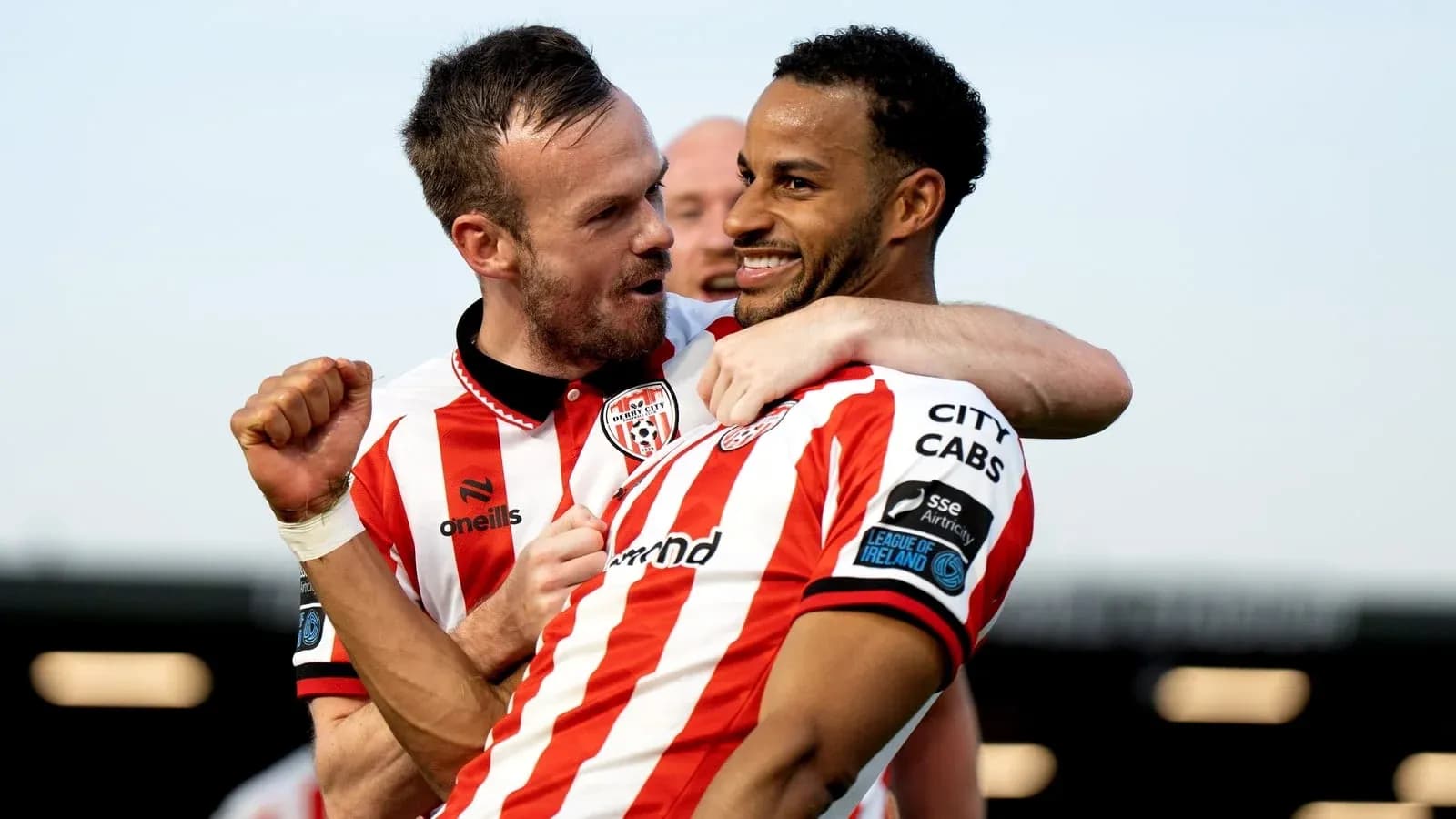 Two players celebrating a goal for Derry City Two players celebrating a goal for Derry City